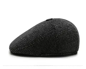 Side view of grey tweed newsboy cap for men featuring a warm wool texture for winter