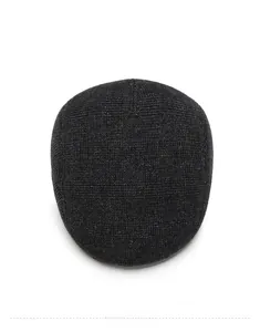 Top view of men's winter newsboy cap featuring black knit waffle texture and warm fabric