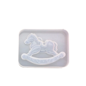 Rocking horse silicone mold for DIY resin and plaster crafts on white tray