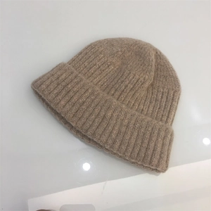 Detailed view of khaki mohair knit beanie showing ribbed texture and soft wool blend fabric