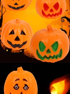 Close-up of assorted Halloween pumpkin lanterns with glowing facial cutout expressions