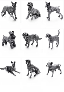 Detailed specs of nine vintage stainless steel dog figurines with weight and size details
