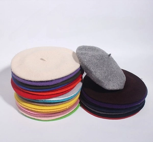 Multiple colors of high-quality wool beret hats showing rich color variety and texture