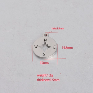 Polished stainless steel round compass pendant with hollow center and N-W-S-E engravings