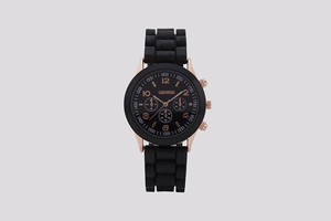 Detail view of fashion women's watch with rose gold case and black silicone strap