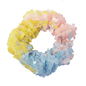 Close-up of colorful mermaid sequin hair tie showing gradient mesh texture