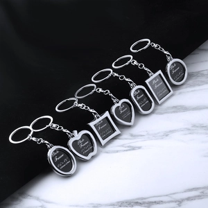 Various hollow alloy photo frame keychains in heart, apple, and geometric shapes