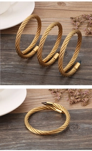 Macro shot of golden twisted cable texture on adjustable stainless steel bangle