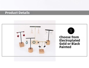 Detail of T-bar earring stands with wooden base in electroplated gold and black lacquer finish