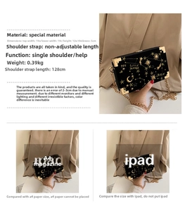 Detail view of black velvet box bag with gold star embroidery and size comparison