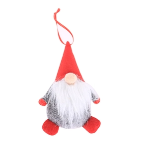 Gnome de Noël fait main avec bonnet rouge pointu et longue barbe blanche sur fond blanc neutre