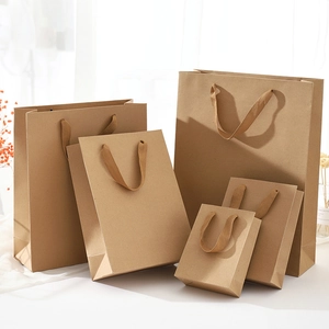 Detailed group view of brown kraft paper bags in various sizes with sturdy handles