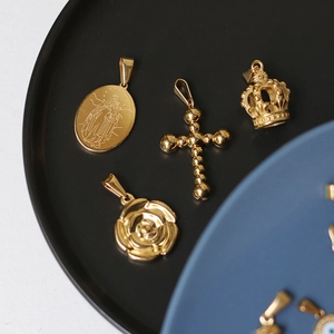 18K gold plated titanium steel pendants featuring rose, cross, and crown charms