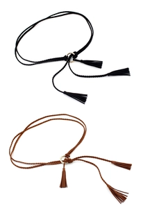 Detail of bohemian braided waist belts with gold metal rings and decorative tassels