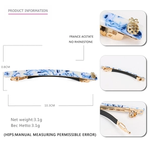 Blue marble acetate hair clip with 10.3cm length and gold pineapple accent piece
