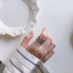 Minimalist 925 sterling silver chain ring shown on index finger with a vintage polished finish