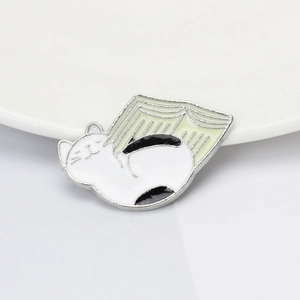Cute Japanese Harajuku style cartoon white cat on an open book enamel pin brooch