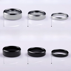 Detail view of 4mm 6mm and 8mm width polished stainless steel rings in silver and black