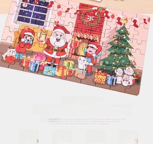 Close-up of DIY wooden Christmas puzzle with Santa Claus and festive tree scenes