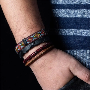 Close-up of four-piece ethnic style multilayer wooden bead and leather woven bracelets