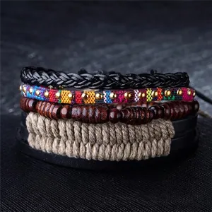 Macro view of multi-layer bohemian bracelet set with woven leather and matte wood beads