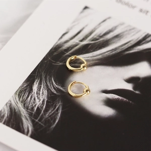 Detailed view of gold S925 sterling silver hoop earrings with bead charm on fashion card