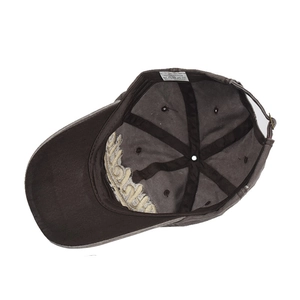Detail view of cotton baseball cap interior featuring 100% cotton label and embroidery
