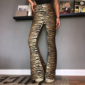 Detail view of high waist tiger print flare trousers with elastic fit and stylish bell bottom