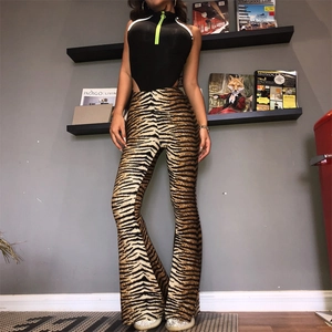 Detail of high waist leopard flare pants and black zip-up bodysuit on model