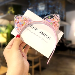 Pink cat ear headband for girls featuring floating heart sequins and shell glitter