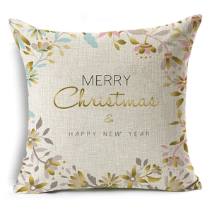 Detail of Christmas linen pillowcase featuring Merry Christmas typography and floral patterns