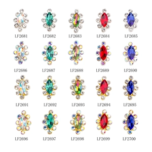 Macro view of crystal nail jewelry charms in silver and gold settings for DIY designs