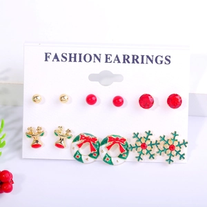 Detail view of 6 pairs of Christmas earrings including reindeer and snowflakes