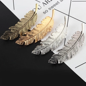 Set of four leaf feather hair clips in antique gold, silver, and bright finishes