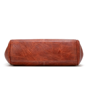 British vintage large brown crossbody bag with embossed texture and white stitching