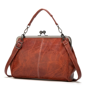 British vintage caramel brown PU leather handbag with metal frame and contrast stitching