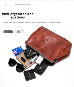 Top view of large brown vintage doctor bag showing interior capacity for iPad and cosmetics