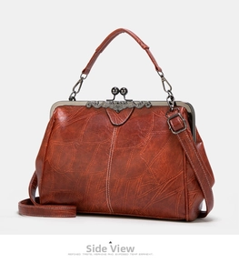 Side view of retro brown leather handbag showing metal clasp and ornate carving