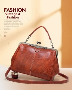 Close-up of vintage doctor bag featuring bronze kiss lock closure and embossed leather texture