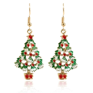 Detailed view of Christmas tree drop earrings with gold hooks and green enamel accents