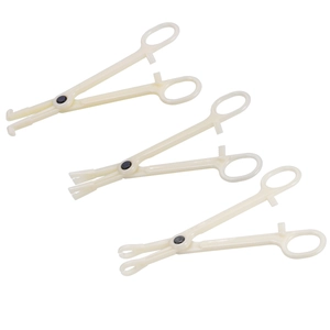 Detailed view of three sterile disposable body piercing clamps with various tip shapes