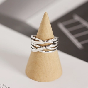 Detailed close-up of S925 sterling silver ring with minimalist woven multilayer design