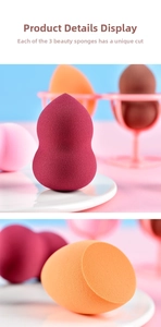 Detailed view of makeup sponge set with various cuts and a pink drying rack