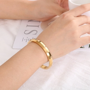 Elegant gold plated stainless steel bangle with faceted design and sparkling crystals for women
