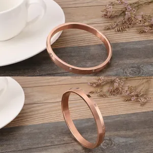 Close-up of vacuum-plated rose gold bracelet with inlaid square cubic zirconia stones