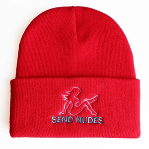 Detailed embroidery of silhouette and SEND NUDES text on red knit beanie cuff
