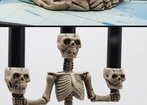 Detailed view of skull candelabra showing resin texture and realistic candle holder design