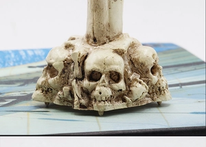 Close-up of Halloween skull candle holder base with realistic aged bone resin texture