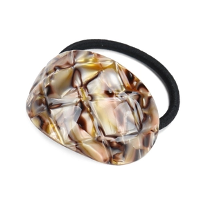 Minimalist tortoiseshell pattern resin hair tie with a black elastic band on white background