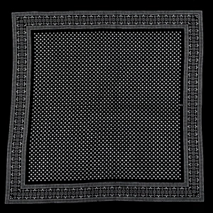Detail of 100% cotton bandana showing black polka dots and geometric floral borders